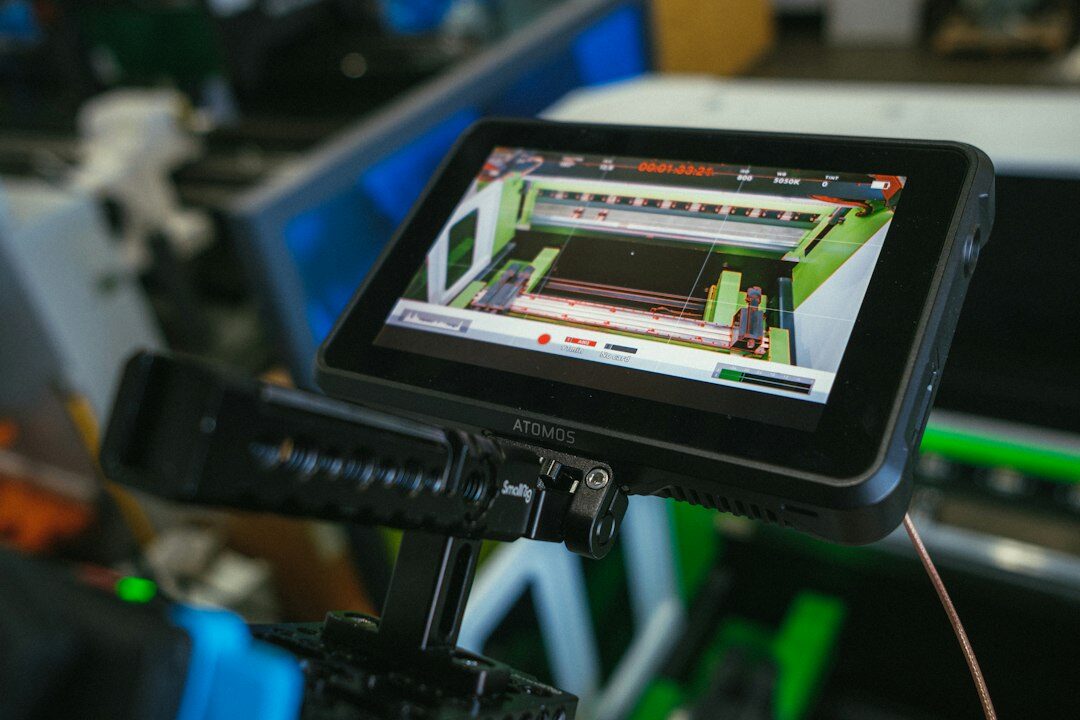 British production planner reviewing a studio run sheet on a tablet