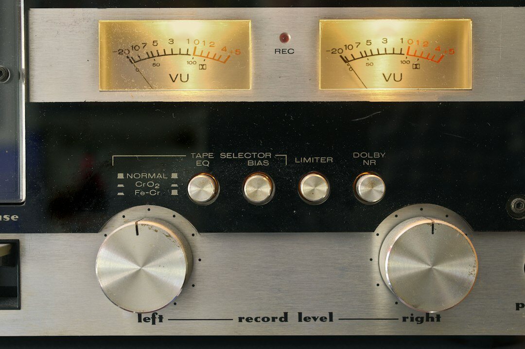 Glowing audio VU meters displaying sound wave levels