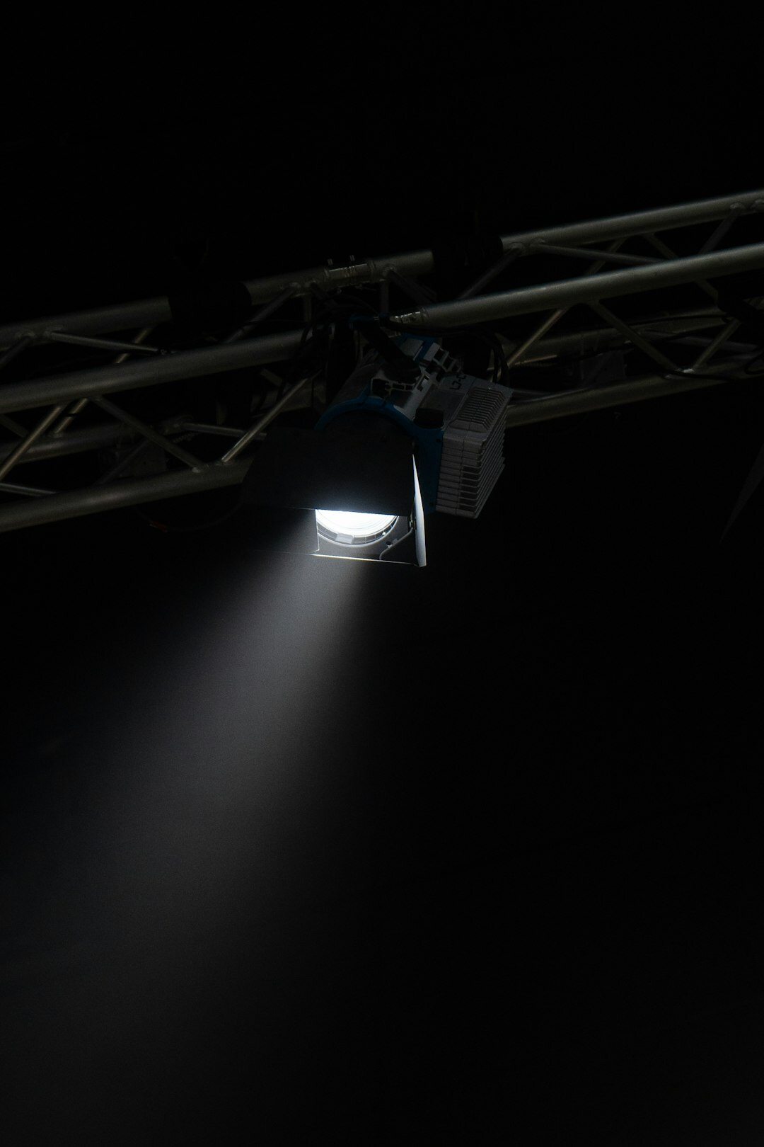 Overhead lighting truss grid mounted on a television studio ceiling