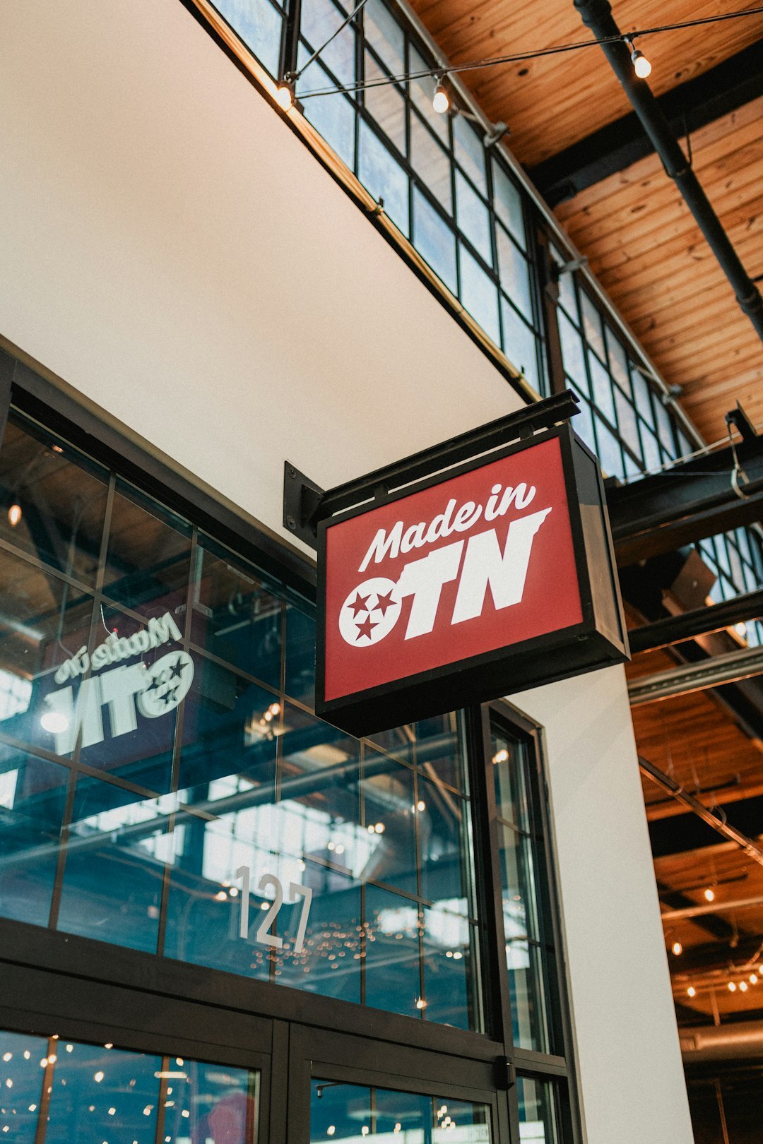 Modern television studio building entrance with signage