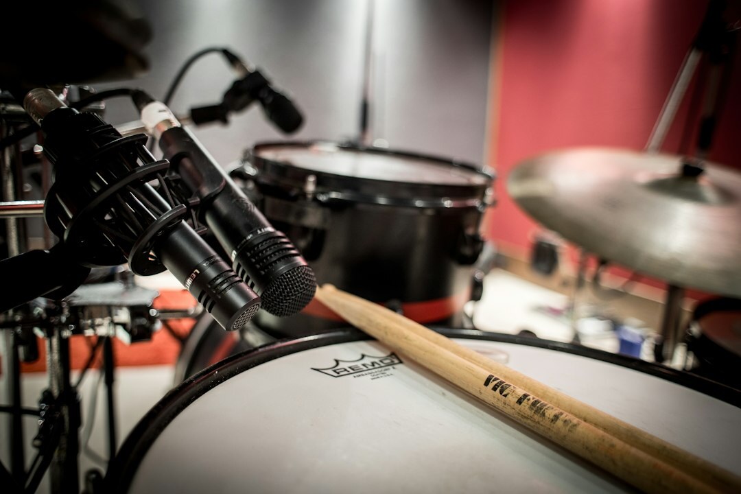 Boom microphone positioned above a television studio set